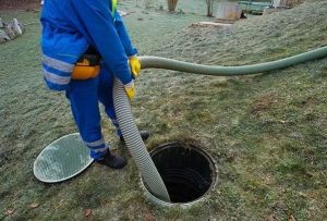 Man preventing a septic backup in Townsville